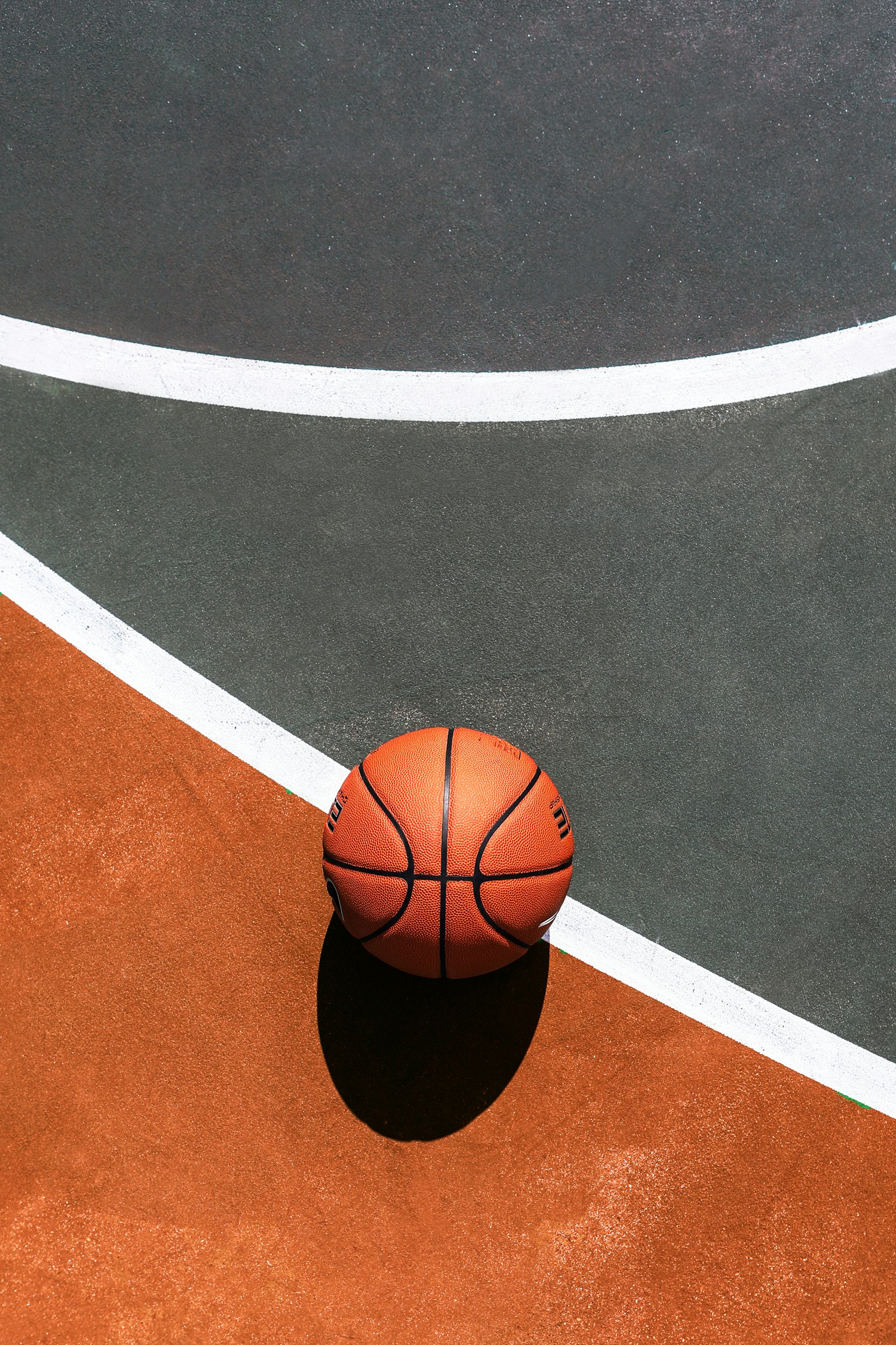 Basketball on a court, seen from above